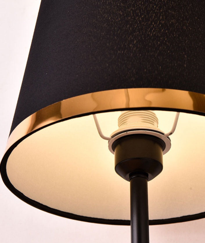 Elegante Tischleuchte in Gold und Schwarz